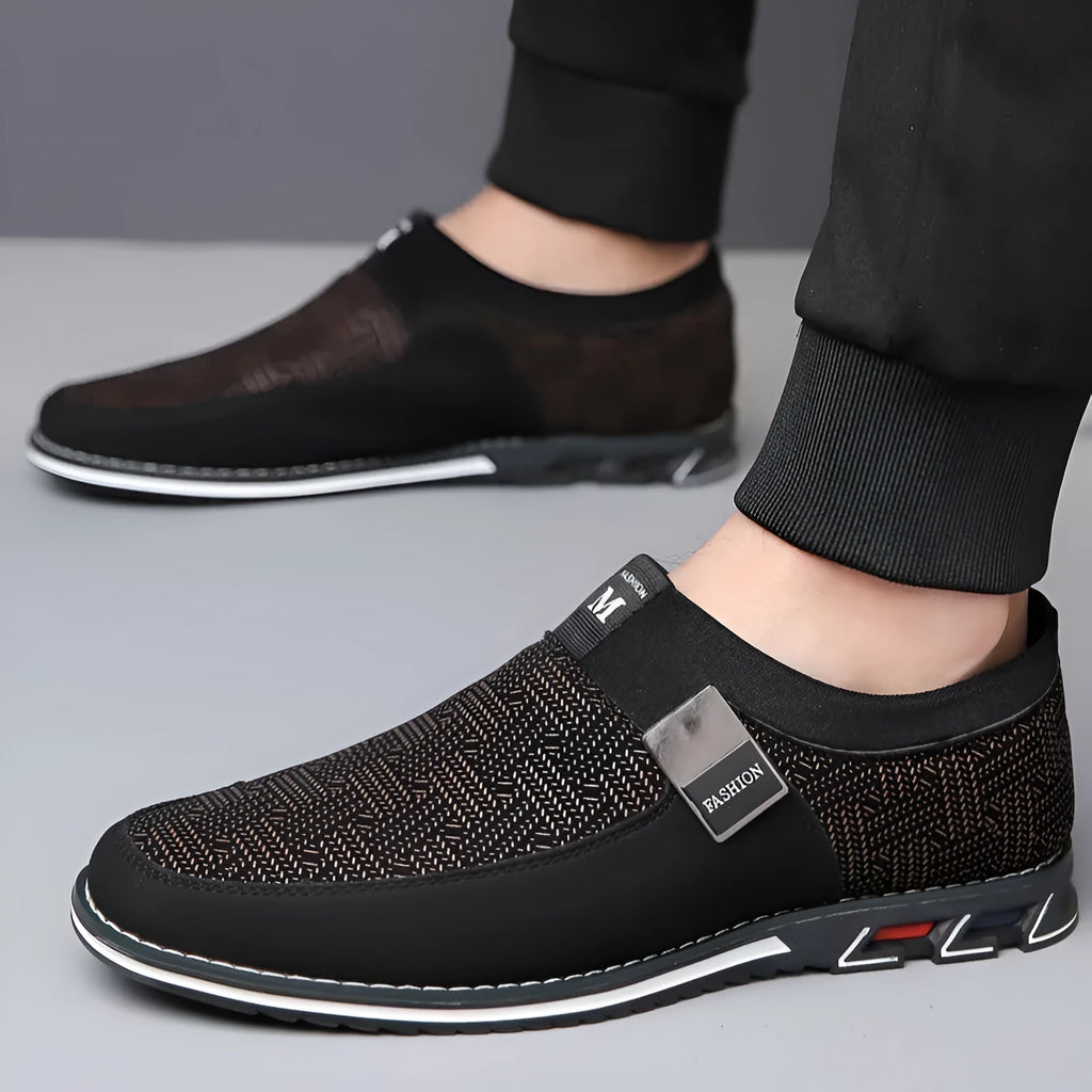 Men's grey and white low-top casual shoes with a square toe and flat rubber sole.