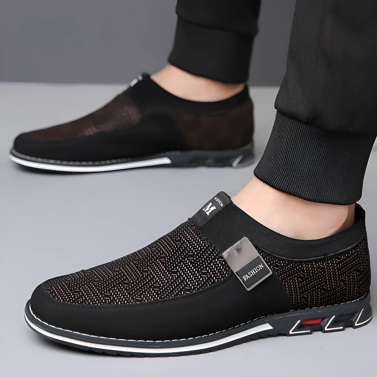 Men's grey and white low-top casual shoes with a square toe and flat rubber sole.