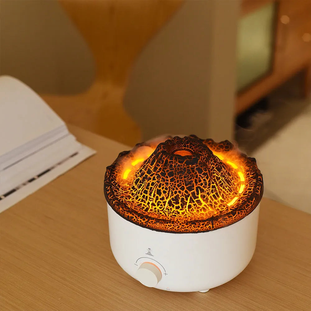 White volcano-shaped humidifier and essential oil diffuser with orange and blue simulated flame light effect.