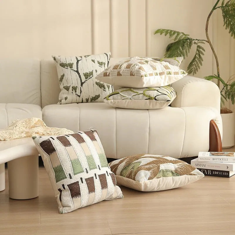 Close-up of a square Jacquard woven cushion cover with a detailed retro floral pattern in various colours.