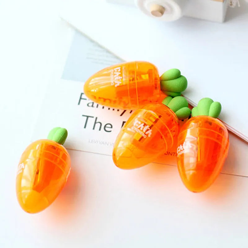 Orange carrot-shaped plastic pencil sharpener with 7cm handle length