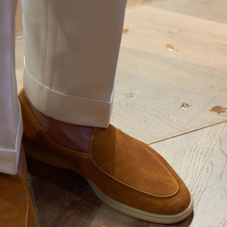 Men's handmade British brown leather loafers with a flat profile and TPR sole.