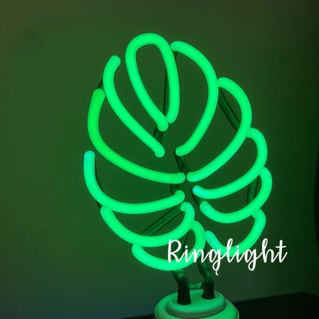 Handmade white bamboo-shaped desk lamp emitting green light, shown in two size options.