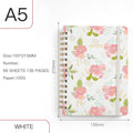 A5 spiral notebook with colourful floral cover, open to show lined pages and metal coil binding