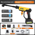 Green wireless high-pressure water gun with metal nozzle and accessories on a table.