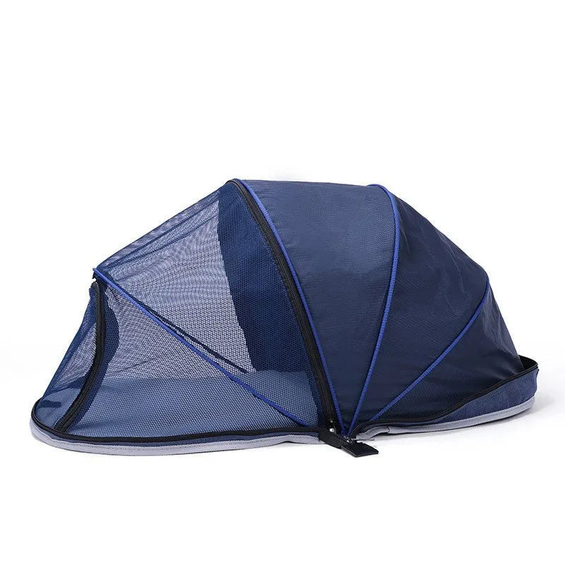 Portable folding cloth tent for cats with mesh side panels and a carry handle.