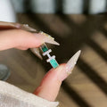 Mint green enamel asterism ring with copper construction and eight-awm star design