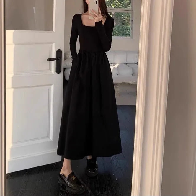Women's black knitted square collar A-line dress with long sleeves and an elastic waist.