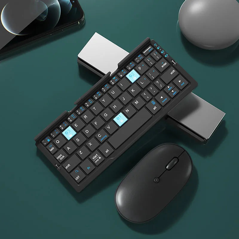 Aluminium foldable Bluetooth keyboard open with phone propped on stand and closed for pocket storage