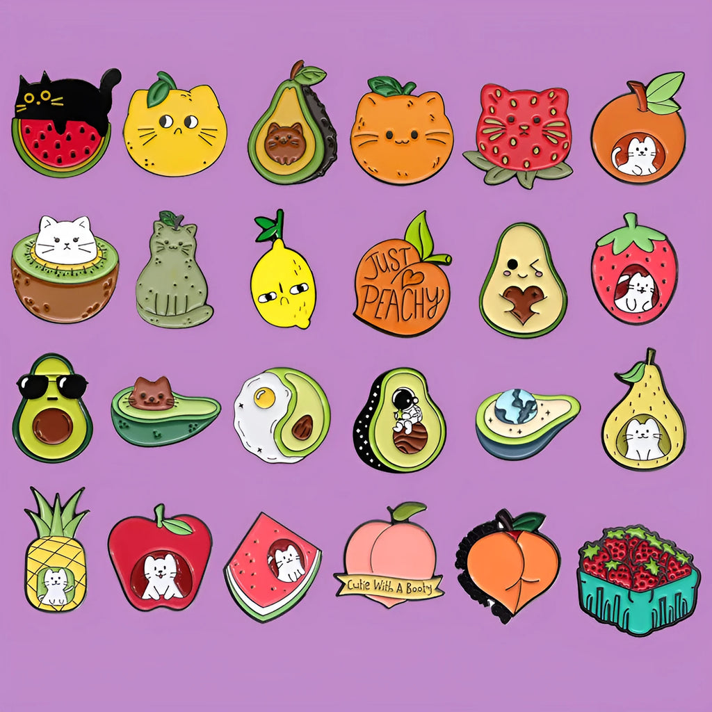 Colourful cartoon fruit and letter design on a metal brooch pin with a secure clasp.