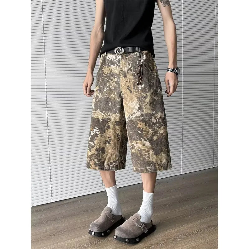 Yellow women's jeans with snake camouflage pattern and cropped leg length.