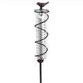 Cast iron bird ornament with glass rain measurement tube showing 0-800ml capacity scale