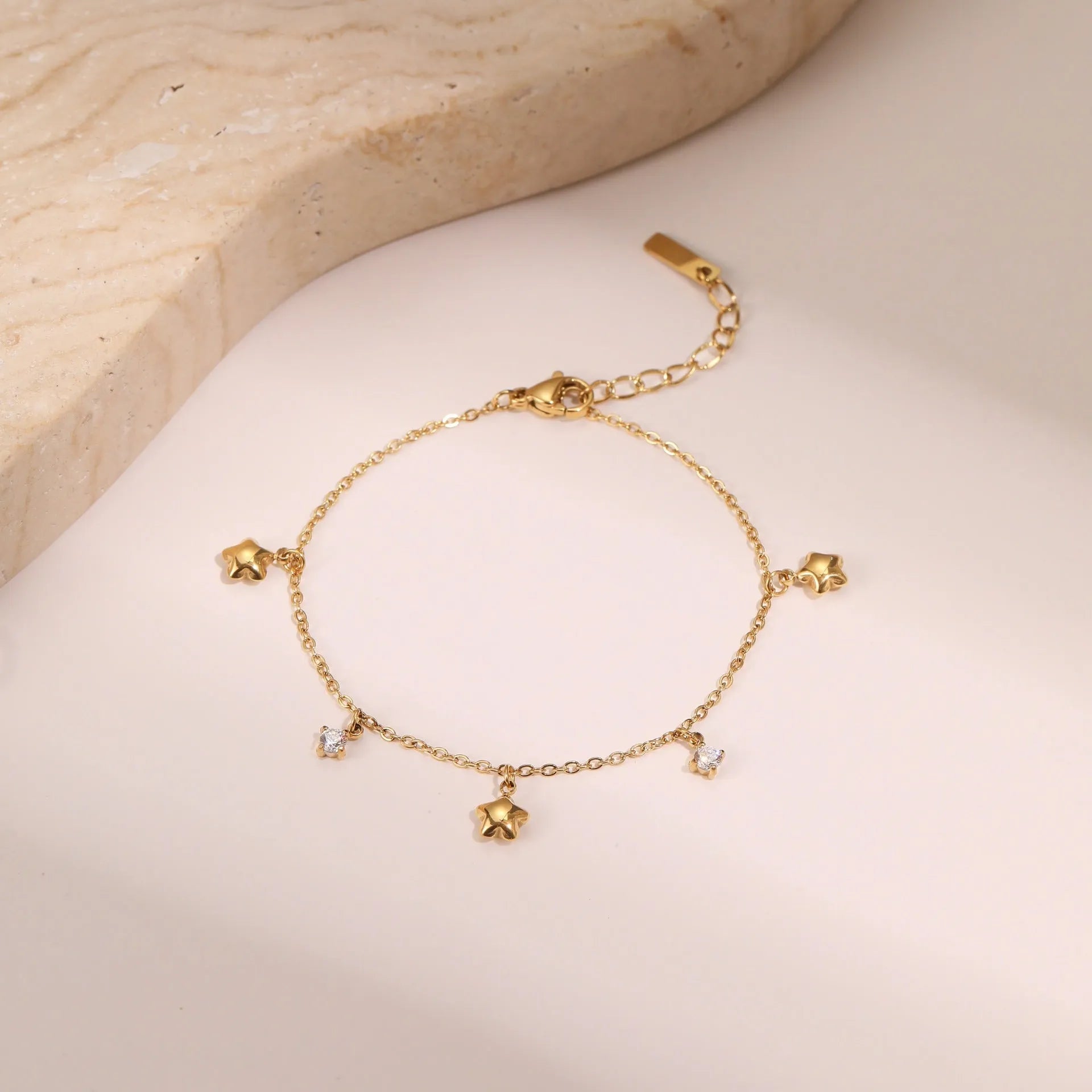 Women's stainless steel bracelet with 18K gold plating and geometric zircon star pendant