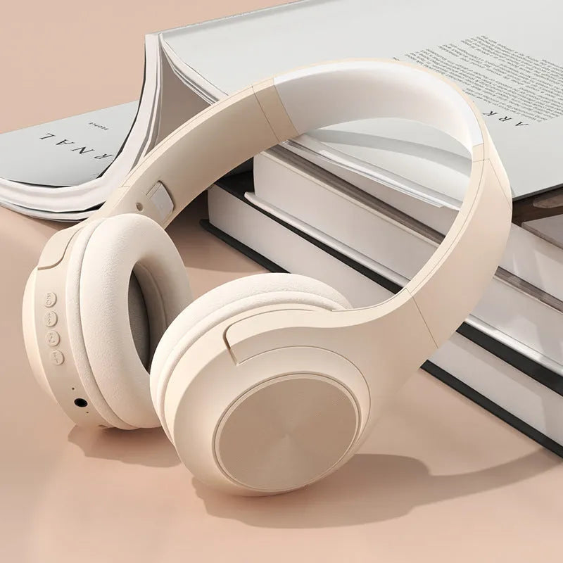 Creative design wireless Bluetooth headset in ivory white colour with a matching charging case.