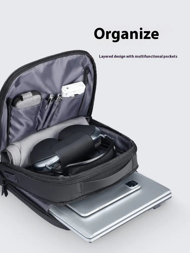 Graphite grey Oxford cloth USB business backpack with external charging port.
