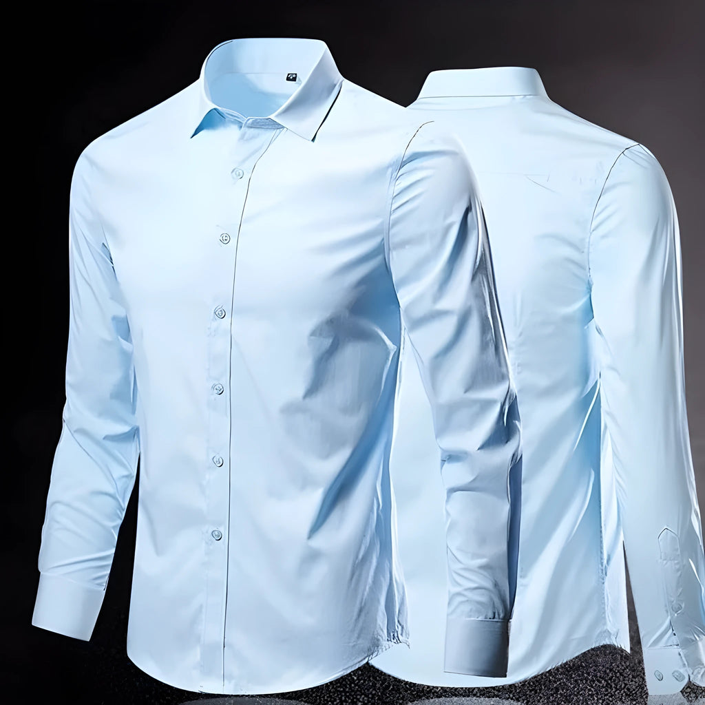 Man's long-sleeve loose-fit linen shirt in a light colour, showing the button front and relaxed silhouette.