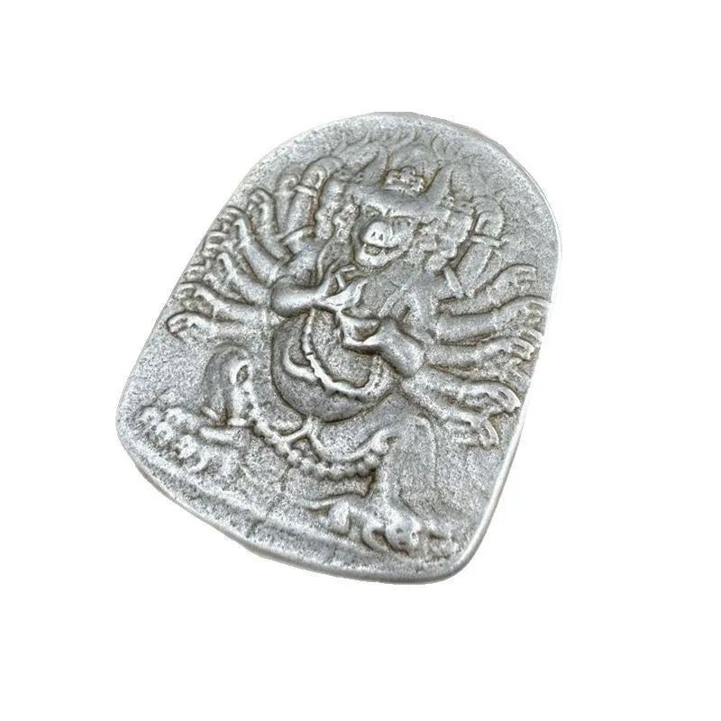 Close-up of an antique iron pendant with Chinese geometric patterns, design Aryaacalanatha Yamantaka.