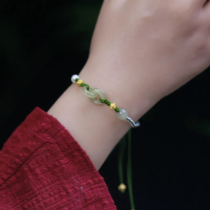 Hetian jade woven bracelet with flexible wire and hollow-out metallic elements