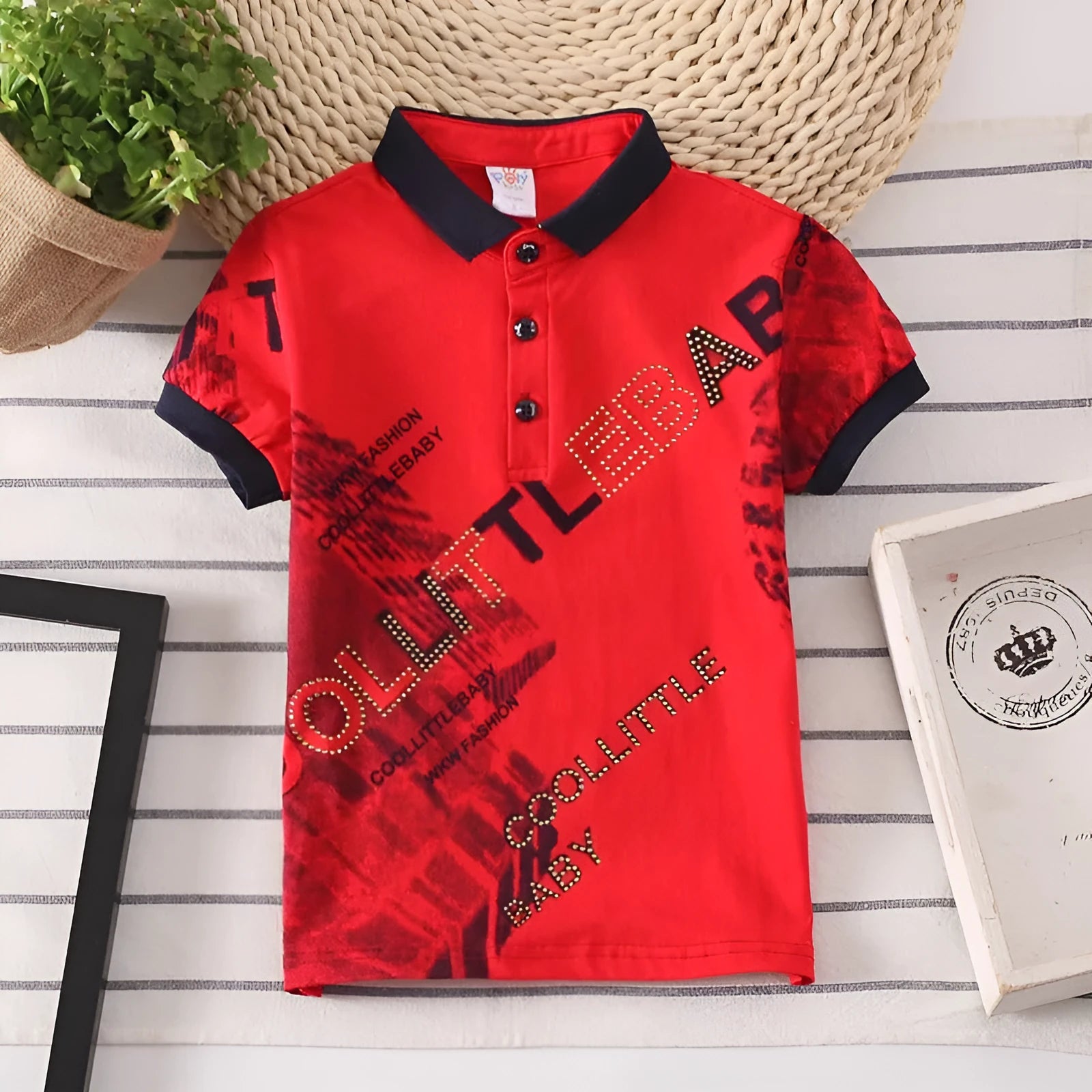 Grey short sleeve cotton shirt with lapel collar for a child, showing moisture-wicking fabric detail.