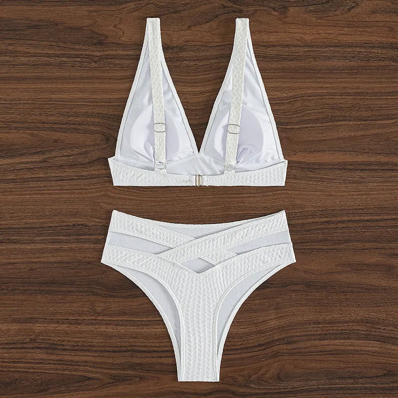White backless women's bikini swimsuit with briefs style on mannequin