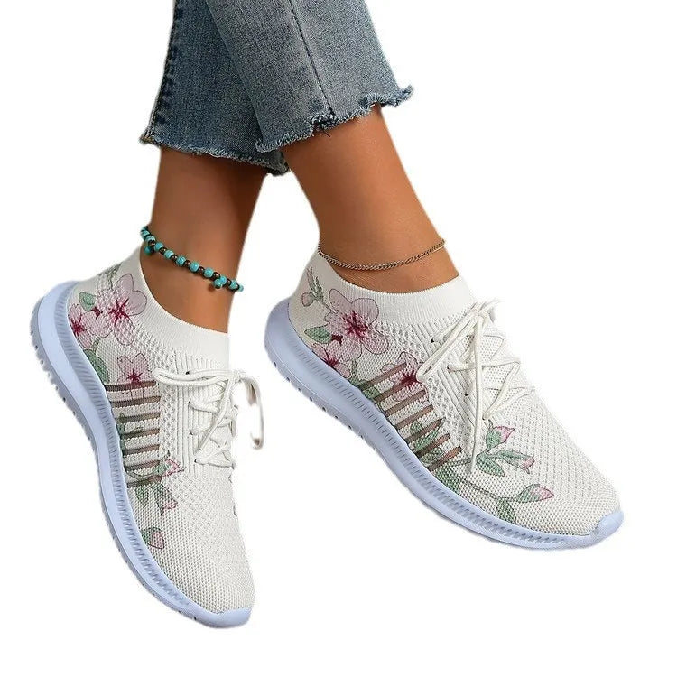 Women's Milky White mesh Flyknit running shoes with flat heel and round toe on a rubber sole.