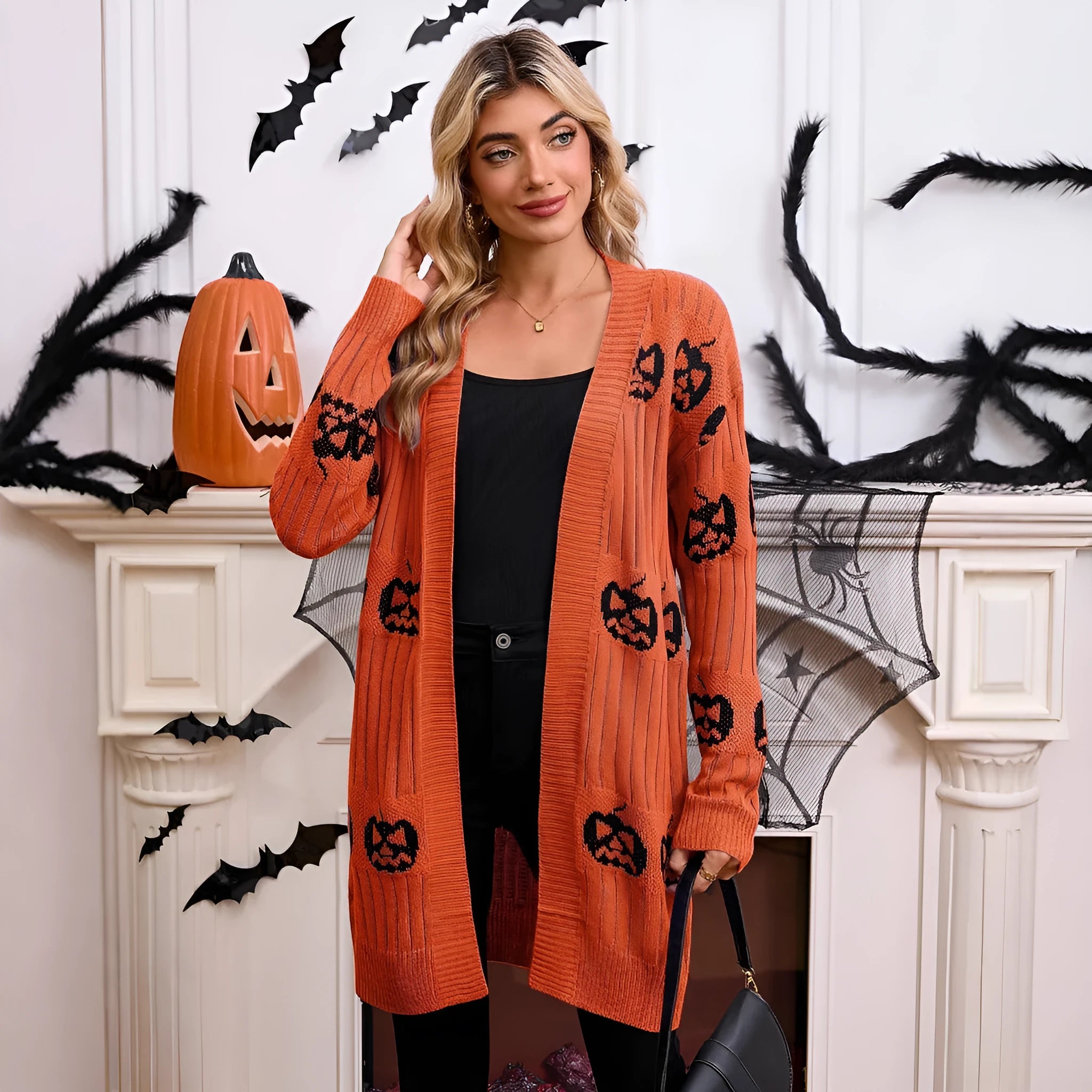 Women's black Halloween pumpkin head jacquard knitted cardigan sweater on hanger