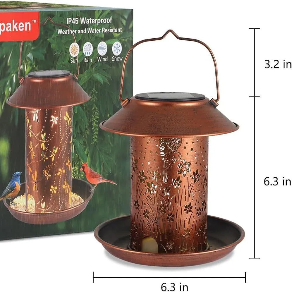 Solar-powered iron art bird feeder with hummingbird design and waterproof IP65 rating for garden placement
