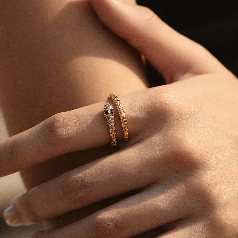 Copper snake ring with adjustable opening and gold colour plating, showing open mouth design