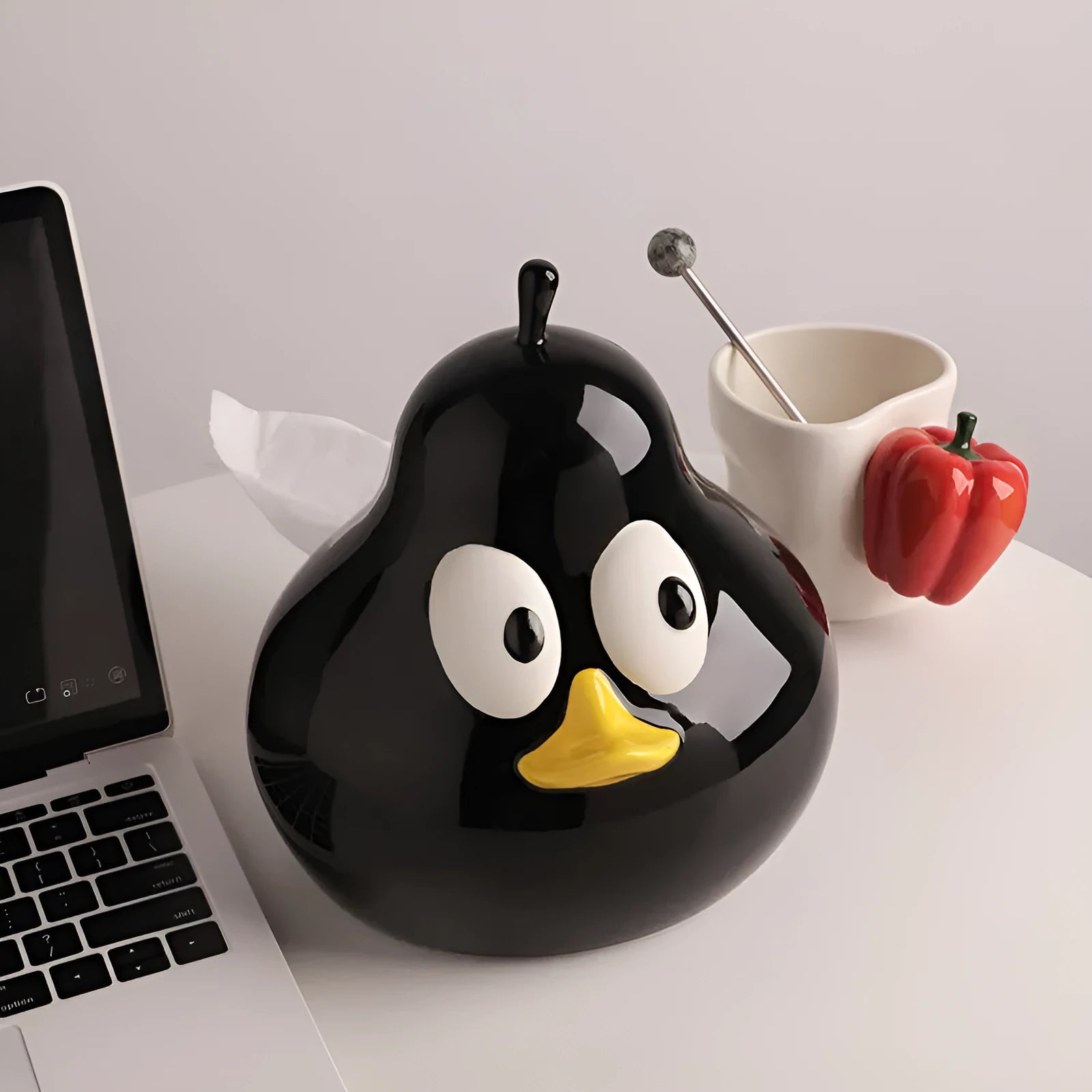 Ceramic pear-shaped tissue box in animal style design available in green or black colour