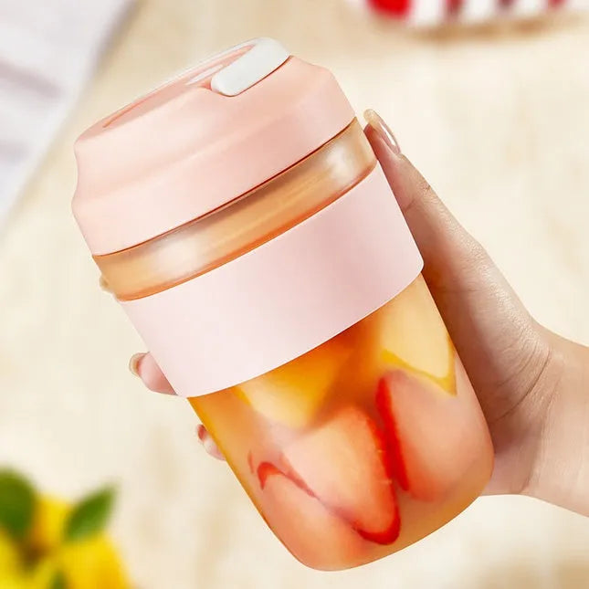 Portable 400ml blender juicer cup with four stainless steel blades in purple, green, or orange colours