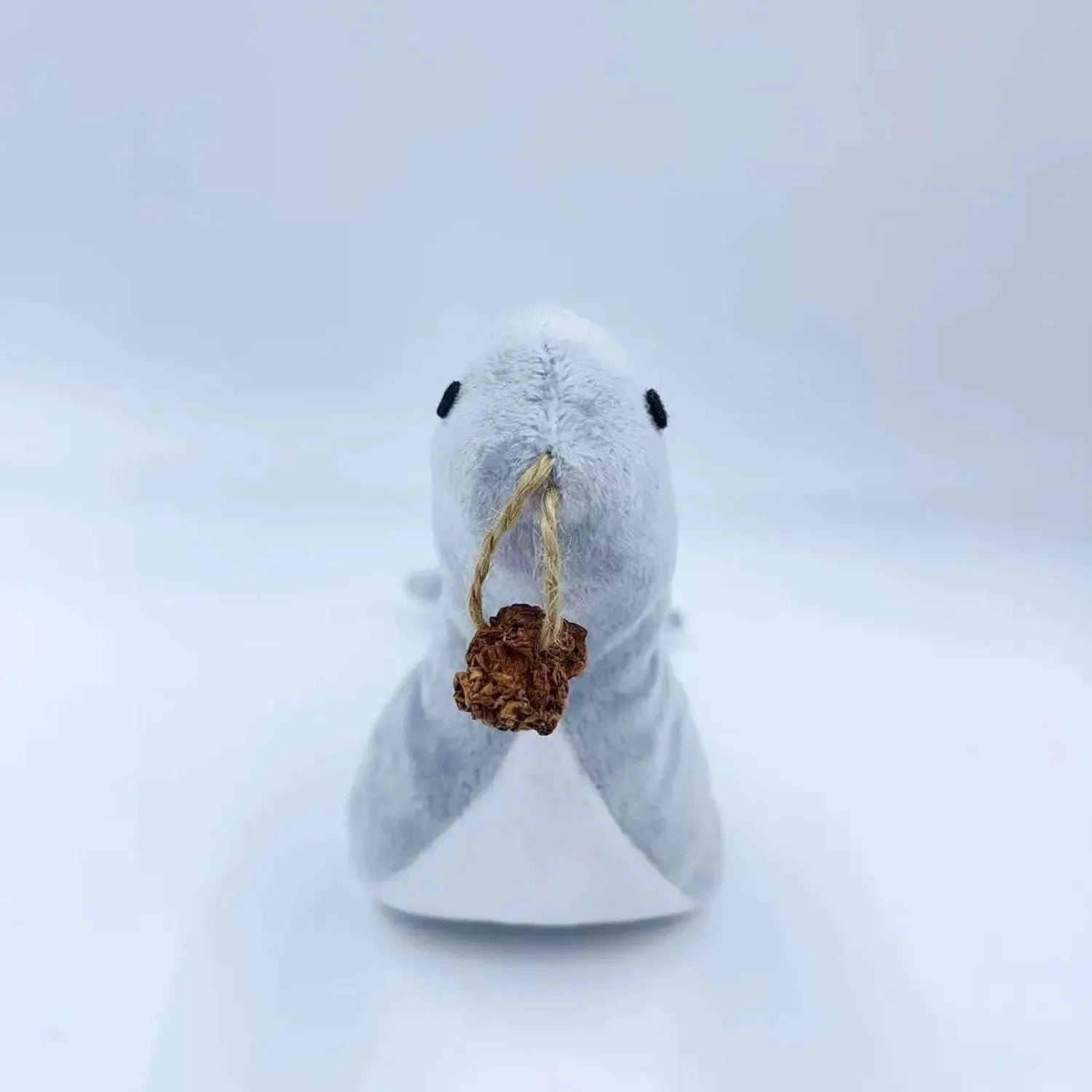 Blue sea lion plush cat toy with bell and catnip filling for play and teething.