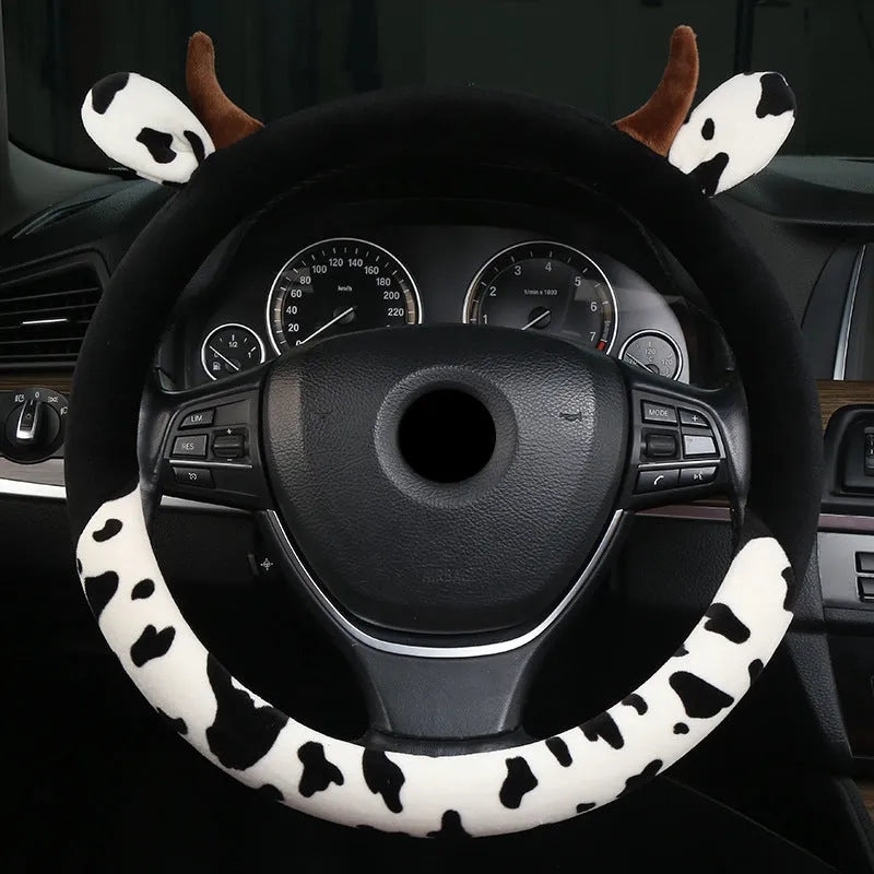 Short plush steering wheel cover in black colour showing comfortable grip surface