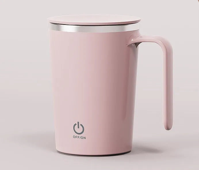 White automatic electric stirring cup with stainless steel finish and minimalist design on a table.