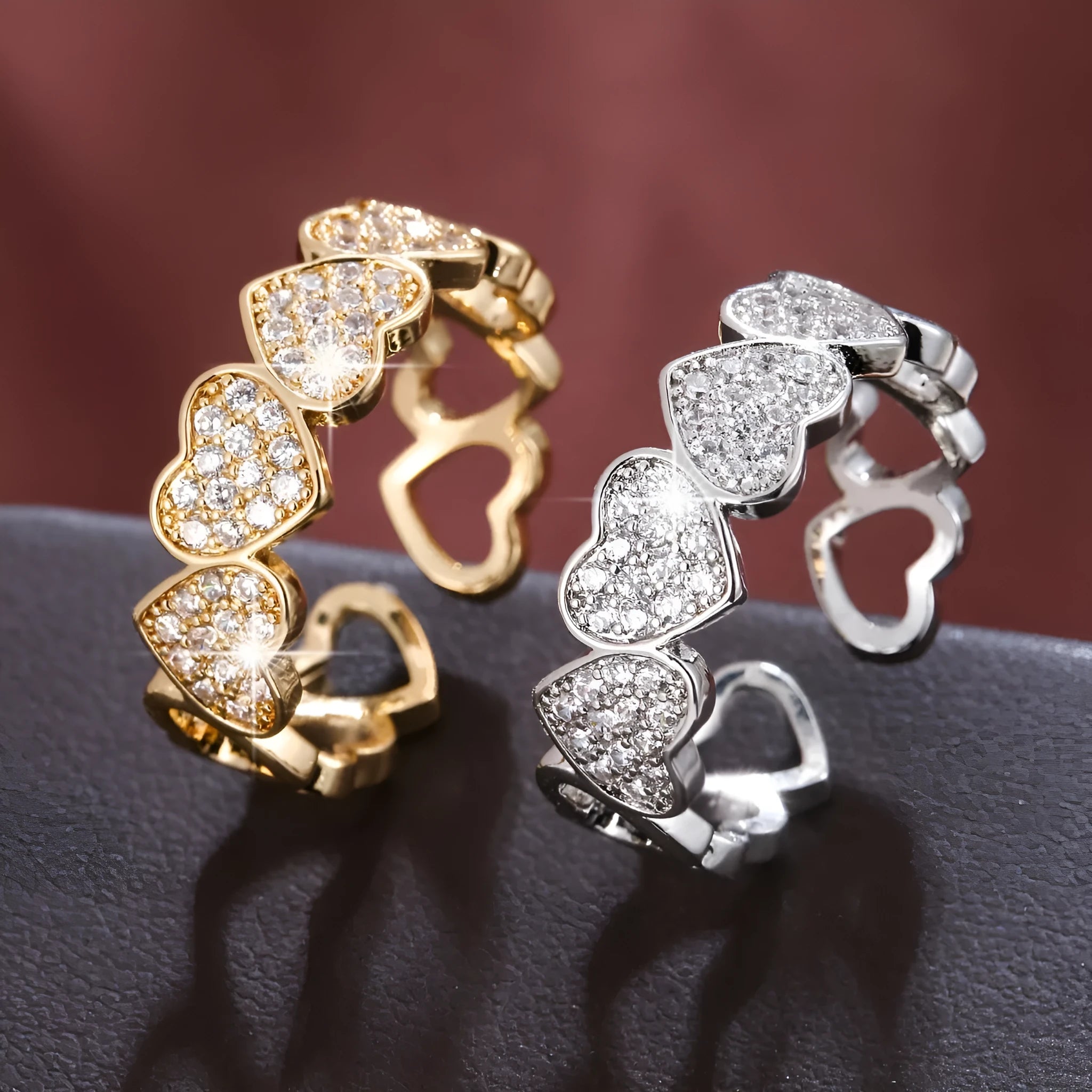 Adjustable gold and silver couples ring with love heart design on a geometry band.