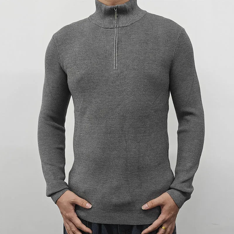 Men's grey half-turtleneck zip sweater with long sleeves on a hanger.