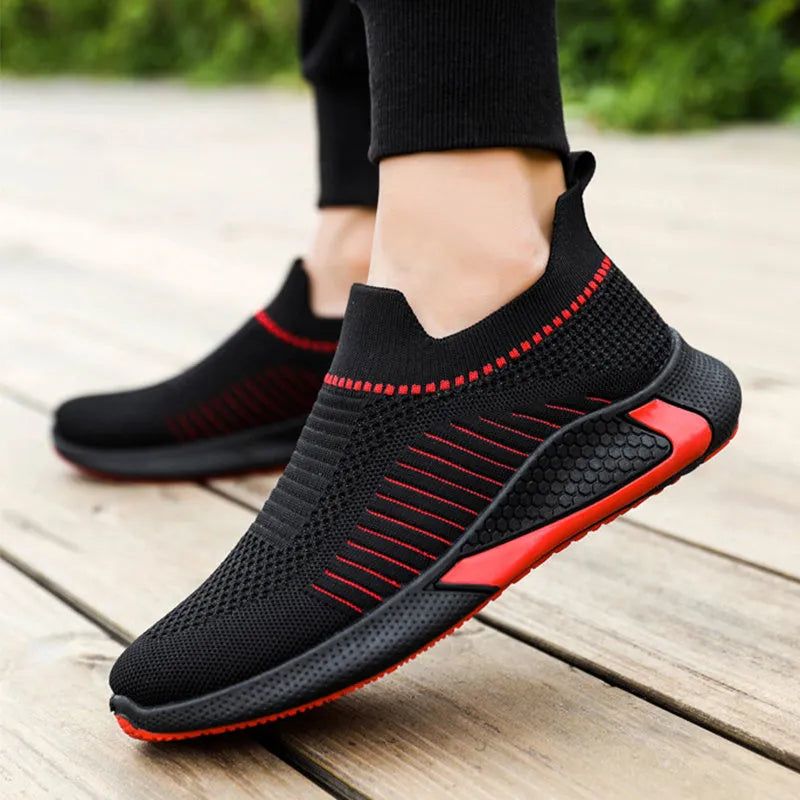 Men's black and white striped mesh sock sneakers with lace-up front and round toe.