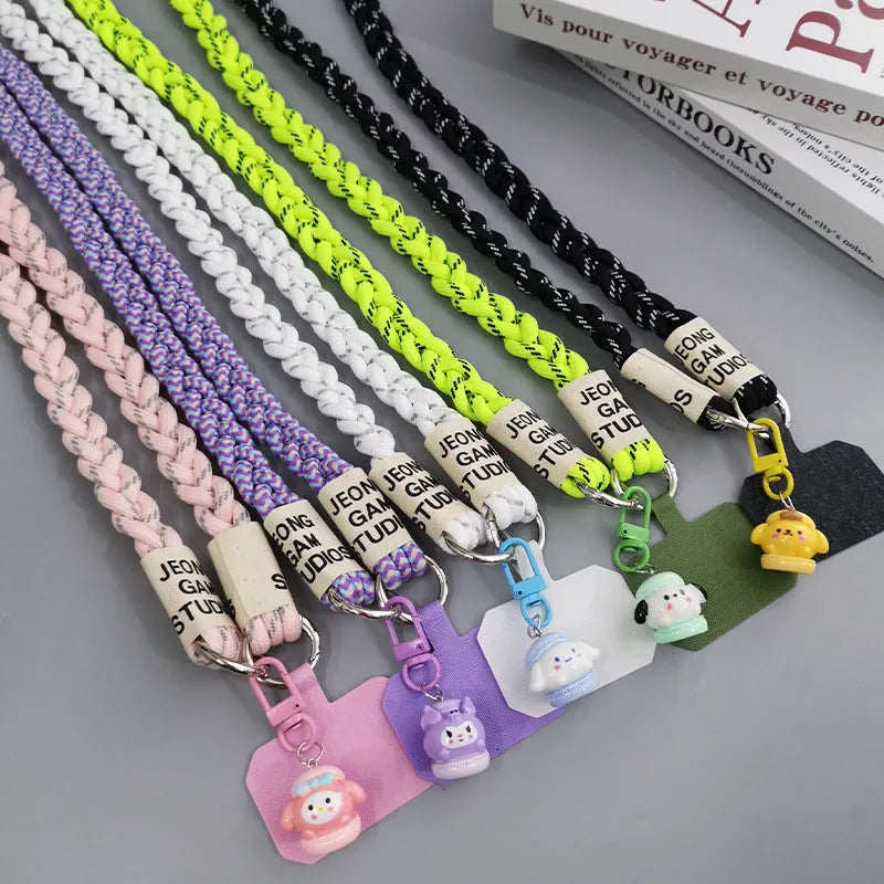 Woven nylon crossbody phone lanyard with macaron pendant in Pink Dot Gray, showing three-strand horse tail detail and matching clip.