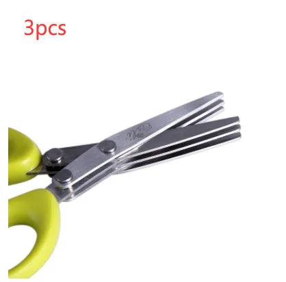 Stainless steel multi-layer herb scissors with green handles for chopping green onions and seaweed.