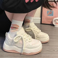 Women's green patent leather platform sneakers with front lace-up closure and rubber sole