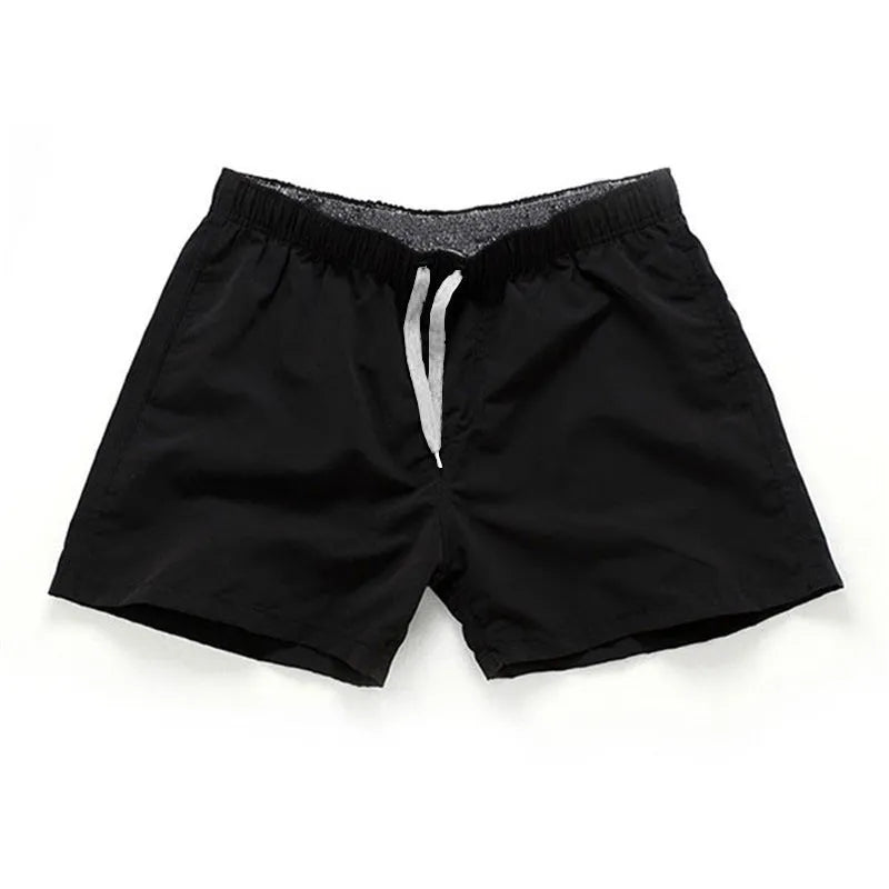 Men's straight leg beach shorts in polyester fabric available in multiple colours and sizes