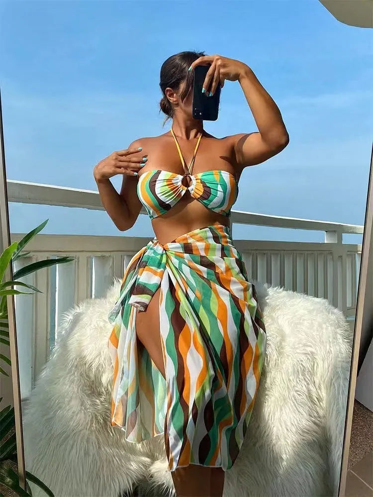Women's printed beach bikini three-piece set with swimsuit top, briefs, and matching skirt in high-elasticity fabric