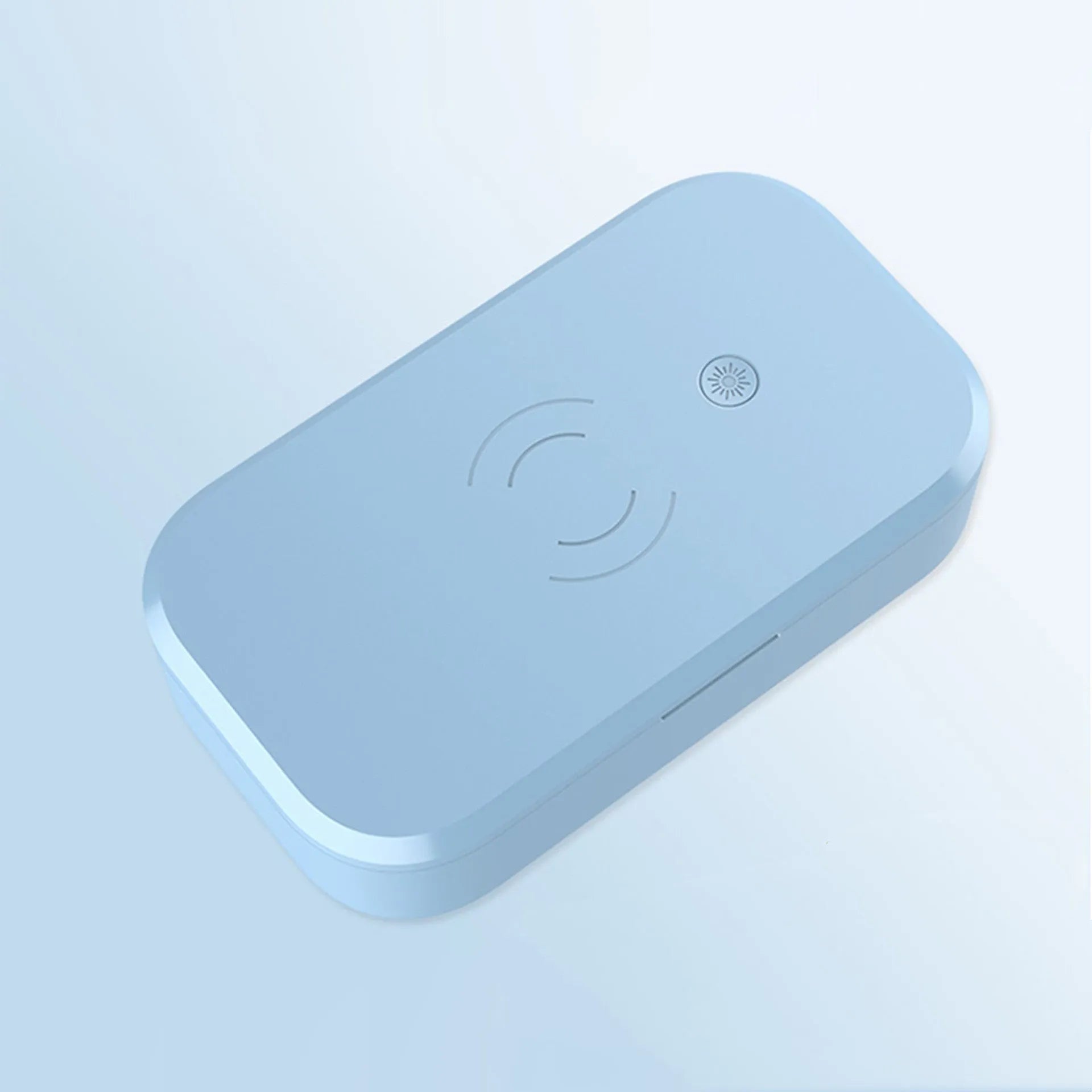 White ultraviolet disinfection box with wireless charging pad on top for mobile phones.