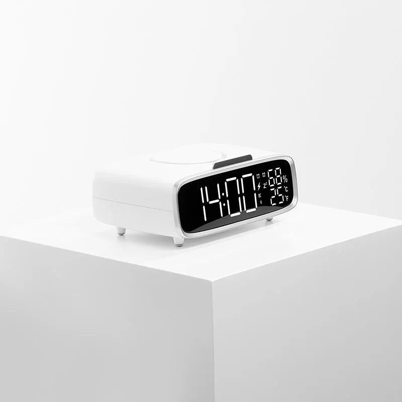 White wireless charging Bluetooth speaker with night lamp functions on bedside table