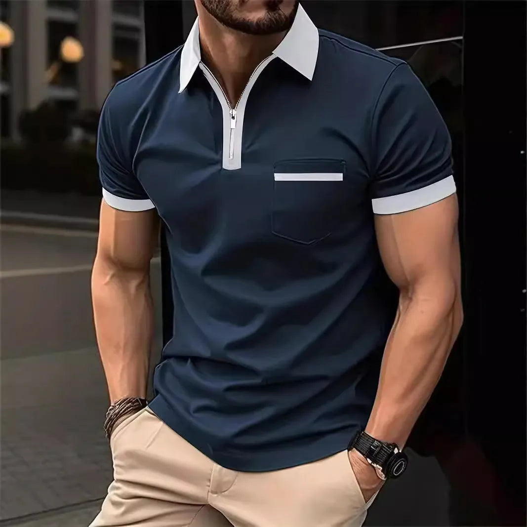 Man wearing a loose-fit short sleeve casual shirt with a chest pocket and zipper detail.