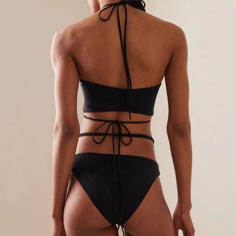 Women's black split bikini swimsuit with lace-up detailing and briefs style design