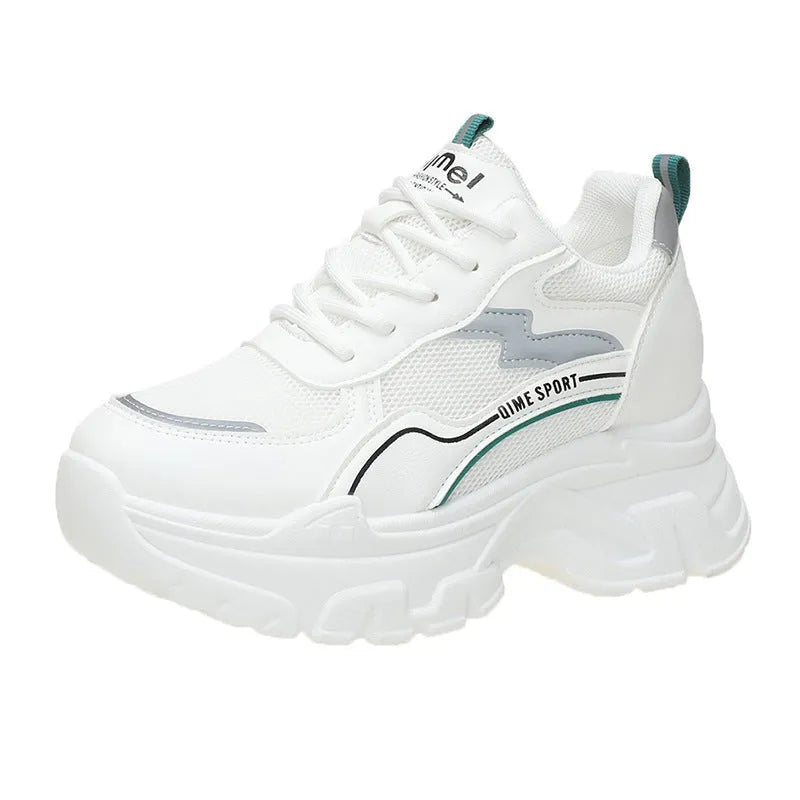 Women's white low-top sports trainers with cross shoulder straps and front laces, made of breathable mesh.