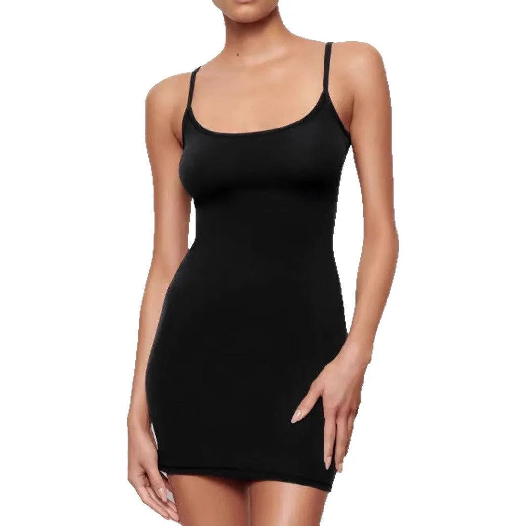 Black sleeveless sling dress with a skinny sheath silhouette and short skirt.