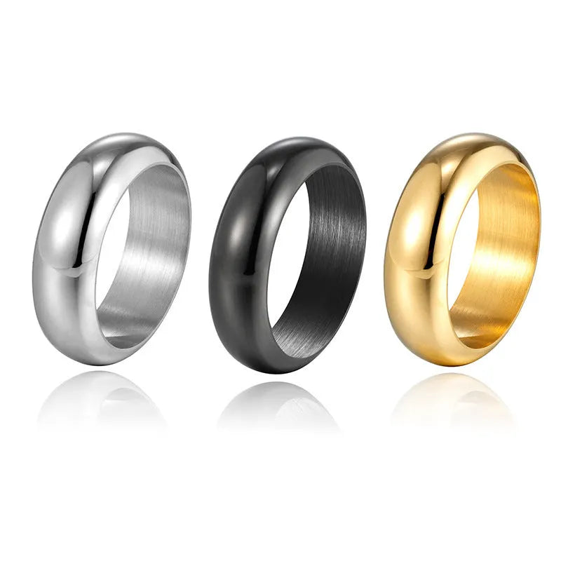 A glossy electroplated titanium steel ring shown in gold, black, and steel colour on a grey background.