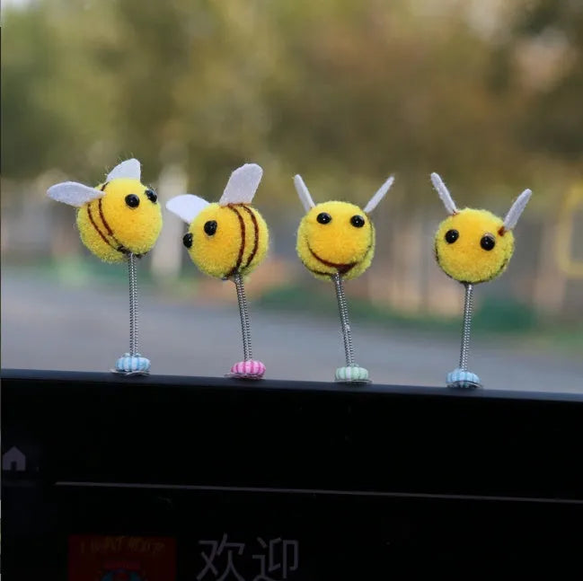 Cartoon bee car decoration with furry texture and swing spring on car dashboard