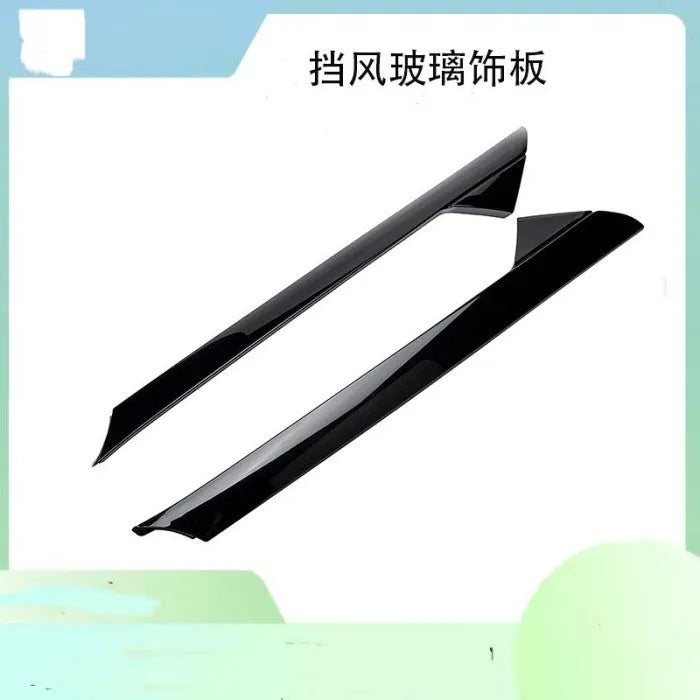 Genuine Ford gloss black front windshield trim panel OEM part.